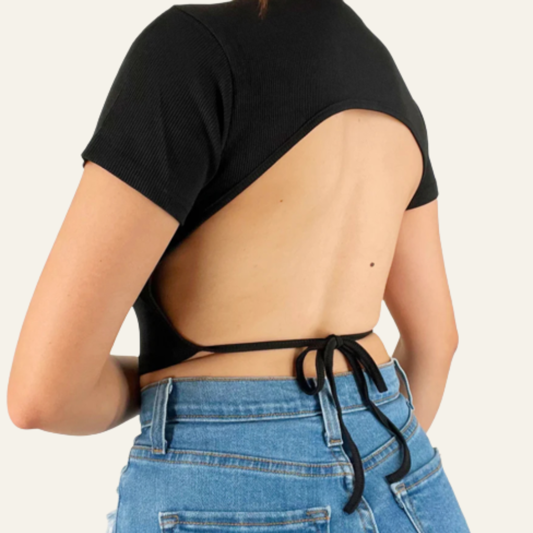 Luna open back crop top in the color black. Its ribbed texture, along with double layer fabric in front and single layer in back give this crop top a classic look.